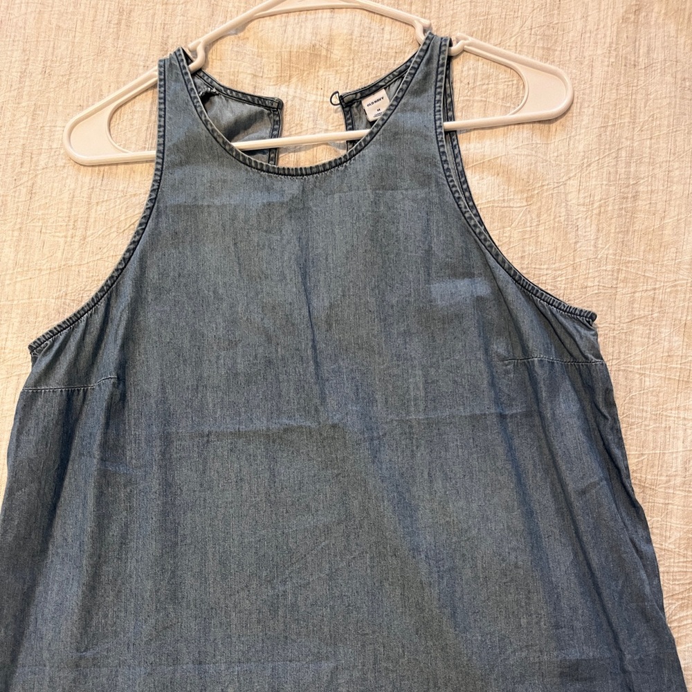 Soft denim sleeveless top with a keyhole back.